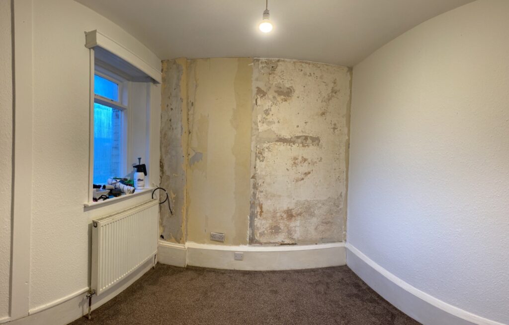 The feature wall after the wall paper fell off